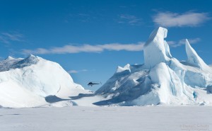 Helicopter flying over the Antarctic.